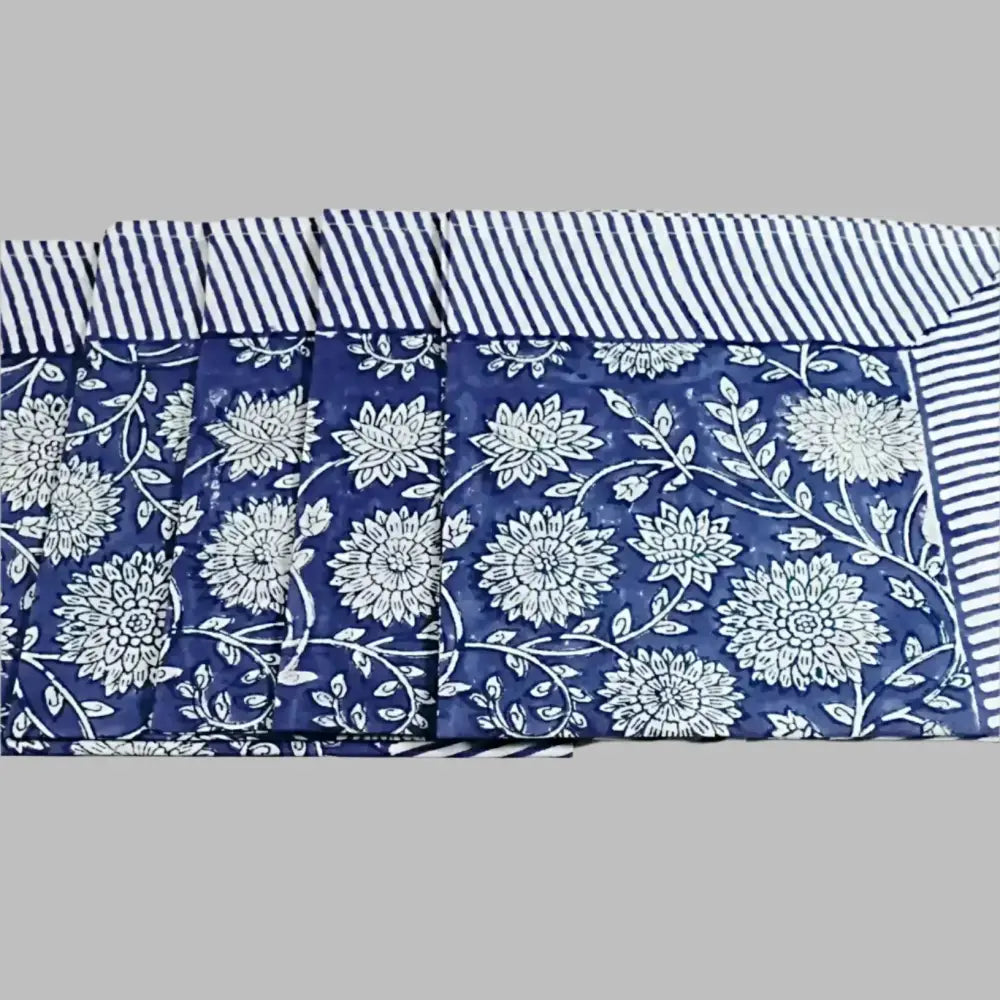 A cotton napkin with traditional Indian block print designs in indigo blue.