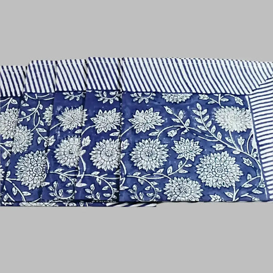 A cotton napkin with traditional Indian block print designs in indigo blue.