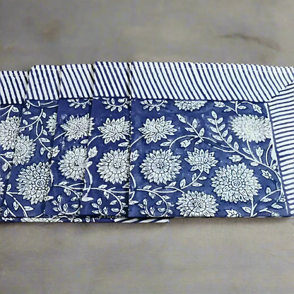 Blue and white floral cotton napkins with striped borders, traditional block print design