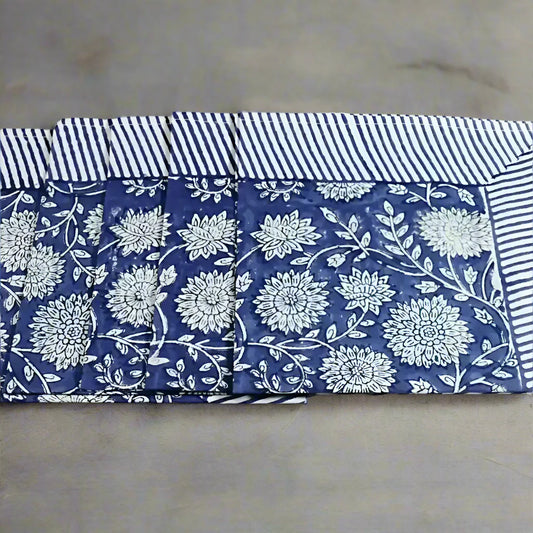 Blue and white floral cotton napkins with striped borders, traditional block print design