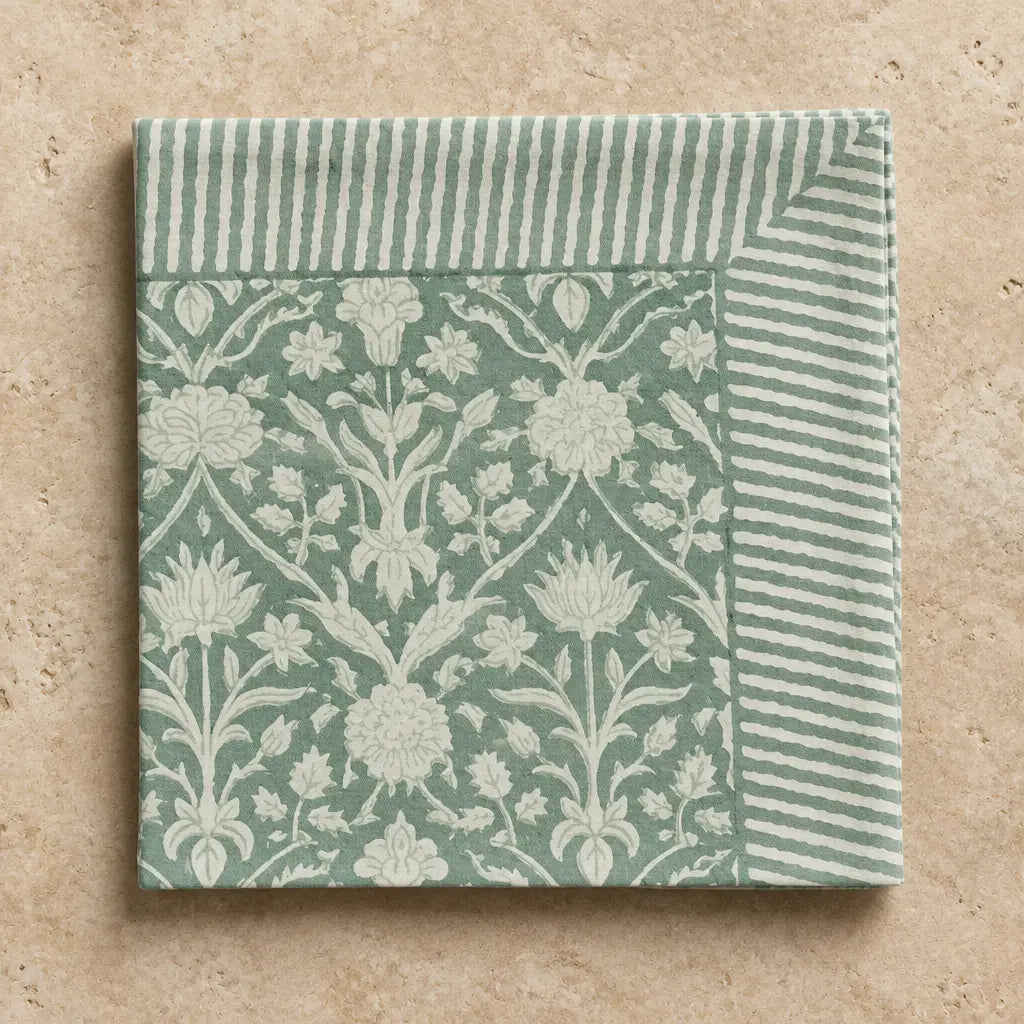 A set of 4 cotton block print napkins in sage green with white floral damask and striped borders for dining use