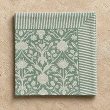 A set of 4 cotton block print napkins in sage green with white floral damask and striped borders for dining use