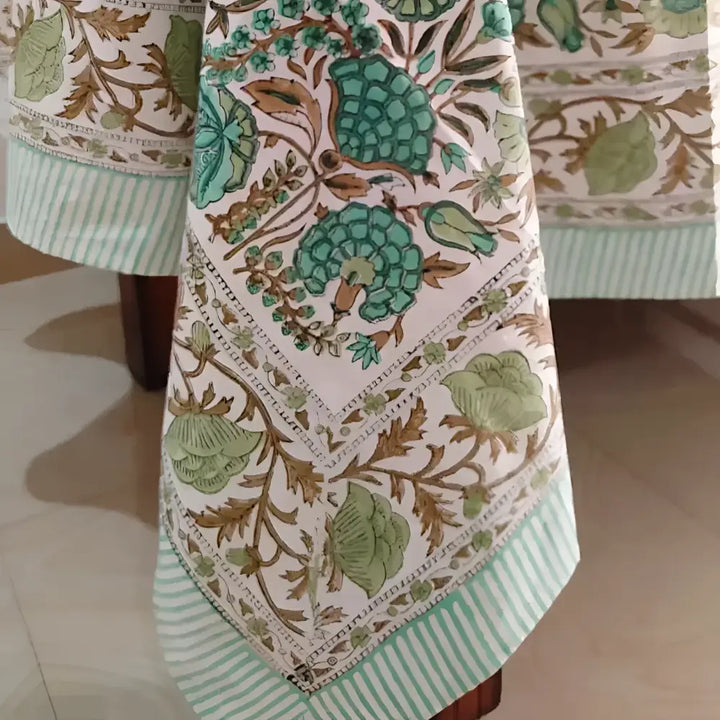 White cotton block print tablecloth with green floral and striped patterns for a stylish look