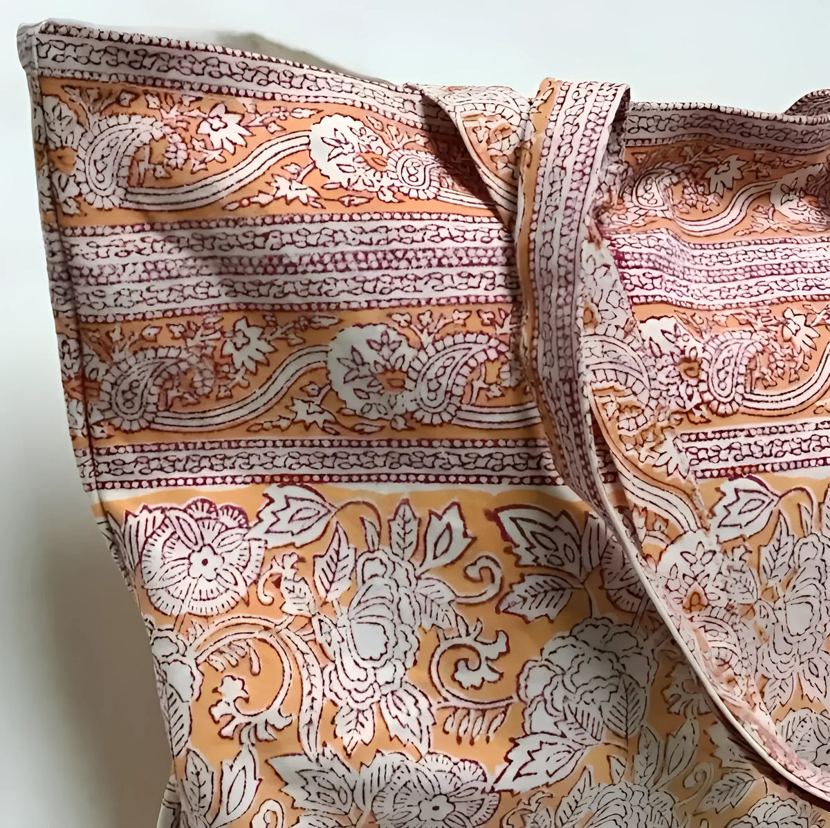 Hand block printing cotton canvas tote with Rashmi orange pattern and floral paisley design