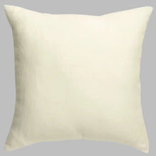 an off white pillow on a white background
