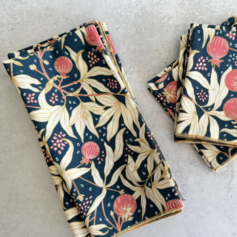 Set of floral-patterned napkins on a light gray surface