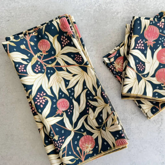 Set of floral-patterned napkins on a light gray surface