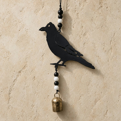 Black metal recycled metal crow bell wind chime with alternating black and white beads and genuine nana bell brass bell