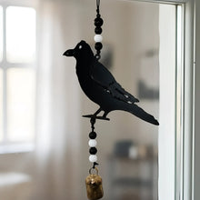 Black metal crow wind chime with alternating black and white beads and genuine nana bell made from recycled metal