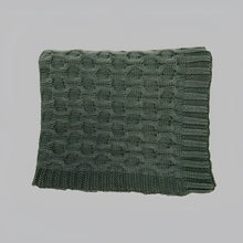 This thick curvy knit throw blanket creates a gorgeous texture with its simple, solid dark green hue.