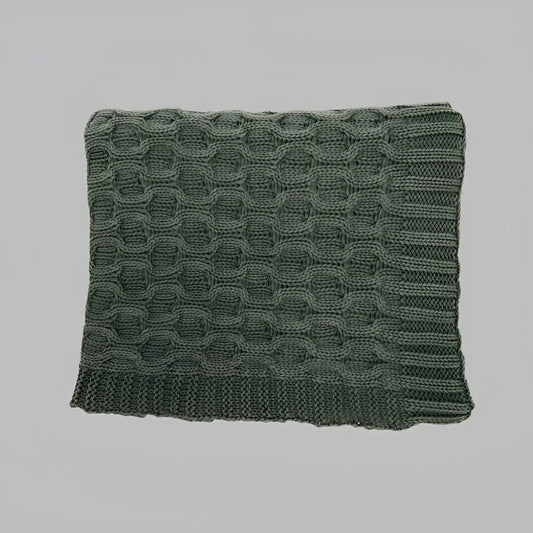 This thick curvy knit throw blanket creates a gorgeous texture with its simple, solid dark green hue.