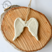 White ceramic angel wing ornament perfect for year-round gifting and home decor