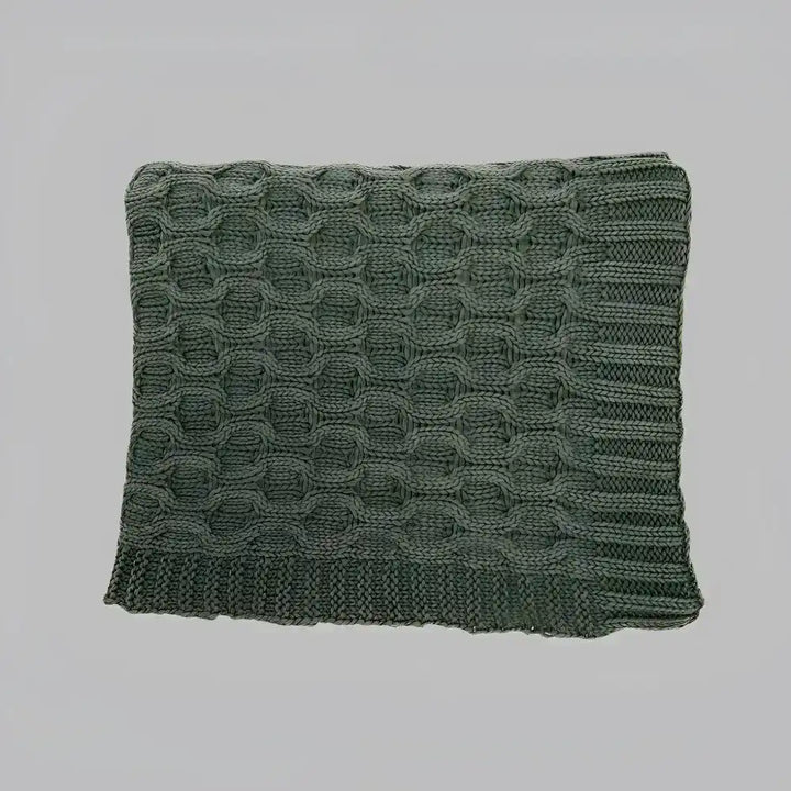 This thick curvy knit throw blanket creates a gorgeous texture with its simple, solid dark green hue.