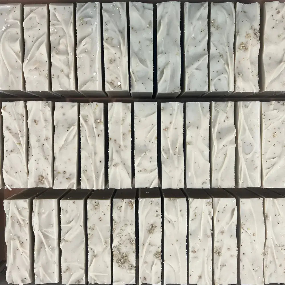 Desert sage soothing bar soap with white rectangular bars textured with dried lavender specks and certified organic essential oils