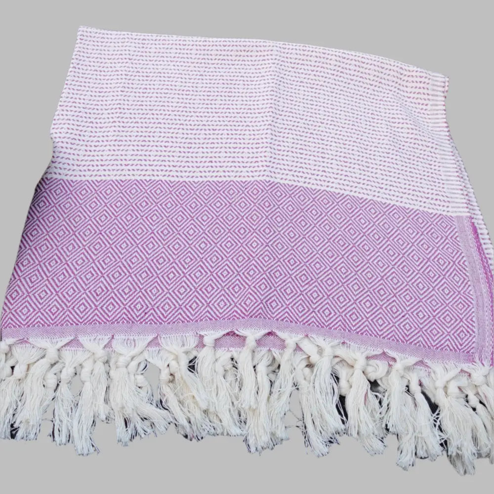 Turkish beach towel with diamond and dot woven design.