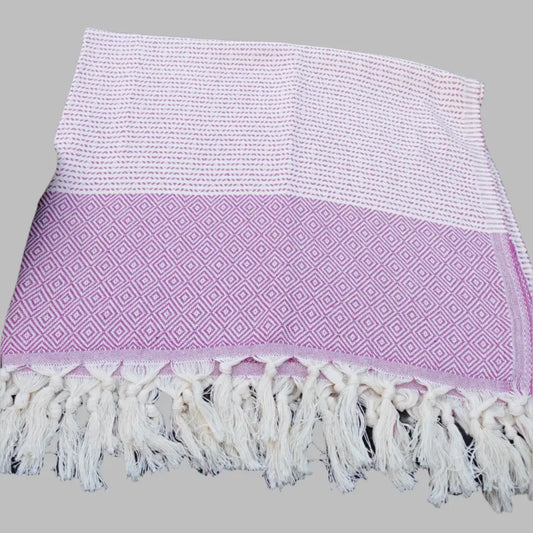 Turkish beach towel with diamond and dot woven design.