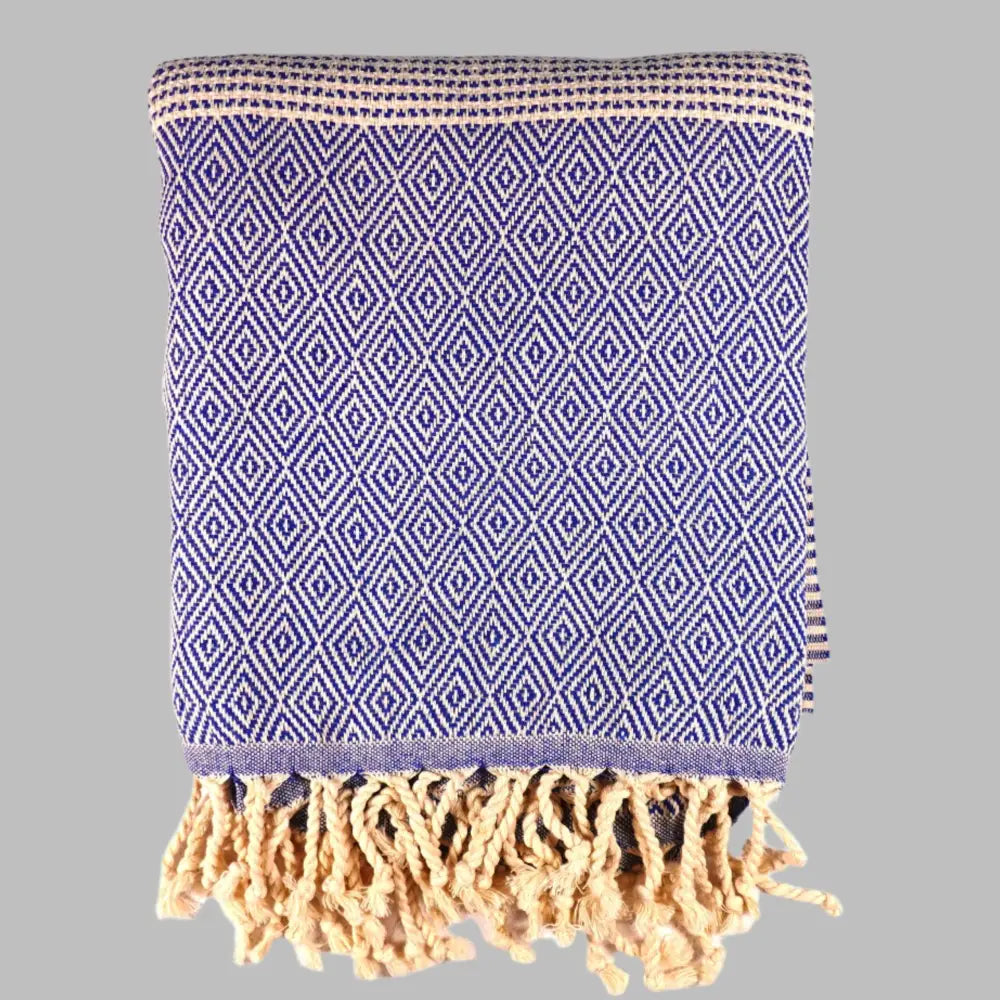 Turkish beach towel with diamond and dot woven design.