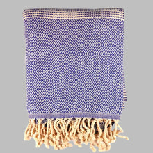 Turkish beach towel with diamond and dot woven design.