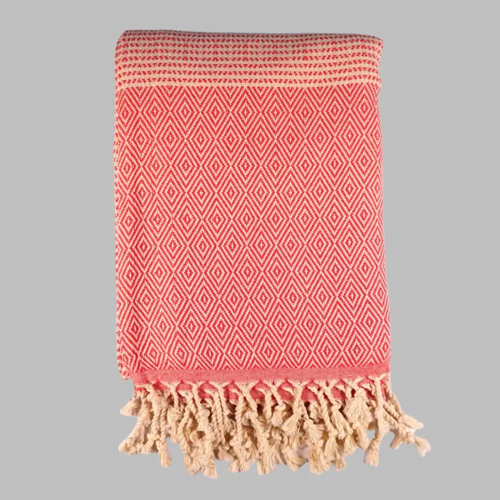 Turkish beach towel with diamond and dot woven design.
