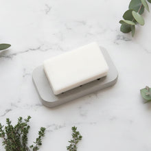 Eco-friendly handmade diatomite soap dish with white soap and pink flowers