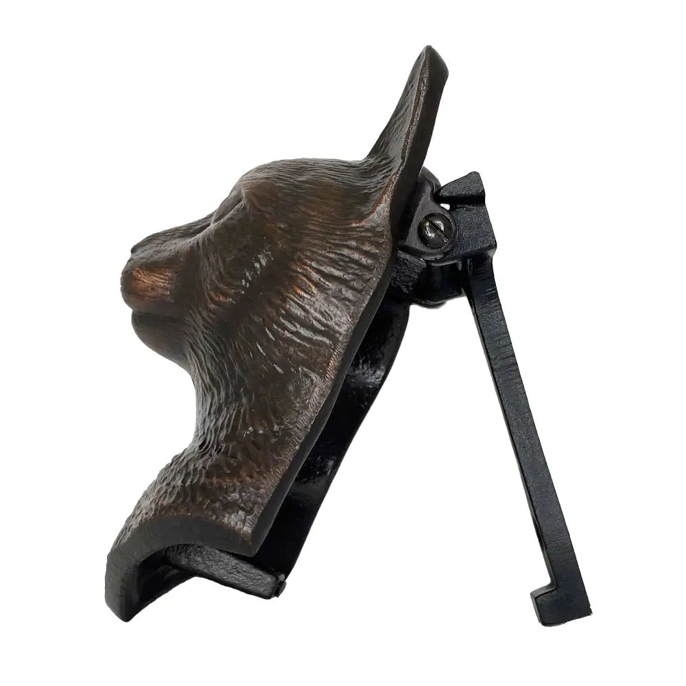 Decorative metal dog head wall mount on a white background