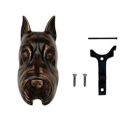 Bronze dog head wall decoration with mounting hardware on a white background