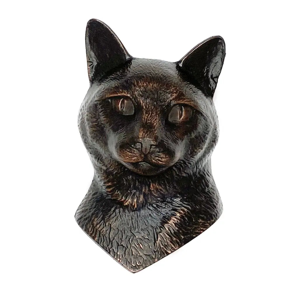 Bronze sculpture of a cat's head on a white background