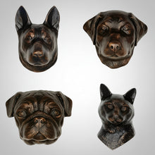 Four bronze animal head wall hangings from Dog and Cat Door Knocker Collection