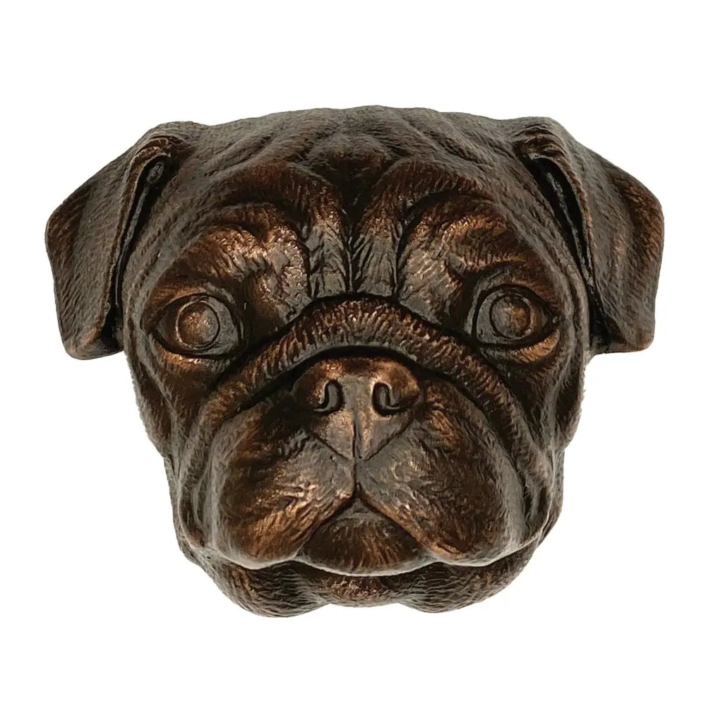 Bronze sculpture of a pug dog head on a white background