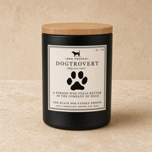 Black cylindrical soy wax candle with natural wood lid and dog silhouette label by black dog candle shoppe for dog people