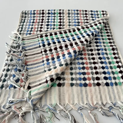 Handcrafted Turkish terrycloth cotton oversized hand towel with pastel colored dots.