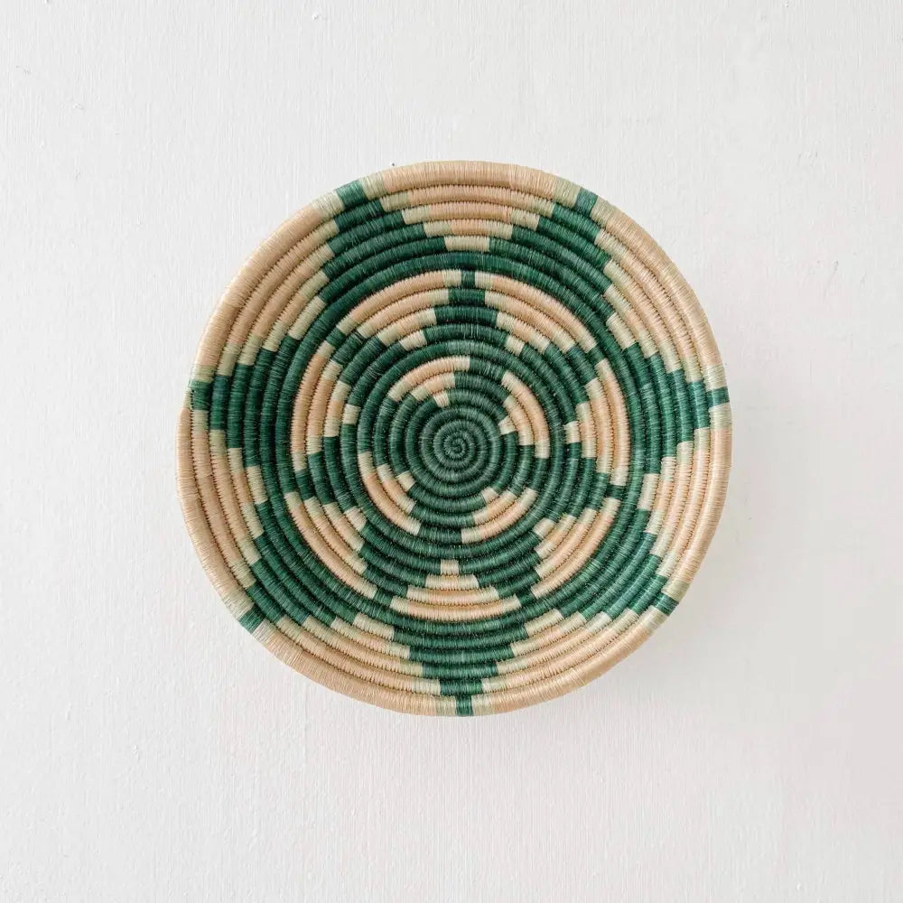 Handmade eco-friendly elonga small bowl featuring a handcrafted circular wall basket with deep green and beige spirals
