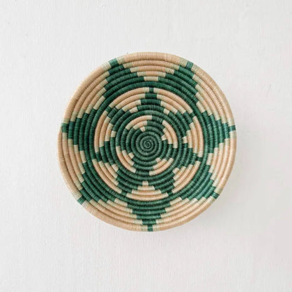 Handmade eco-friendly elonga small bowl featuring a handcrafted circular wall basket with deep green and beige spirals