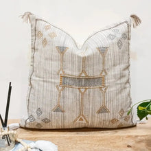 Cotton pillow cover in neutral gray color pallette with hand embroidered details.