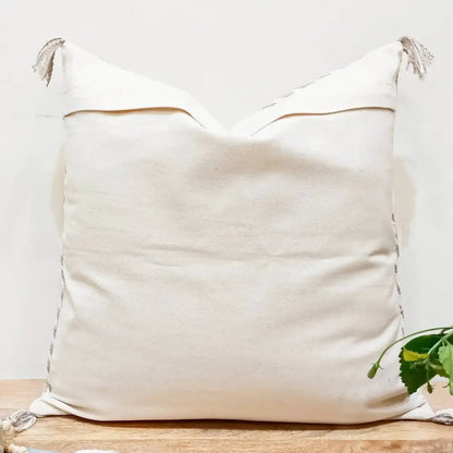 Cotton pillow cover in neutral gray color pallette with hand embroidered details.