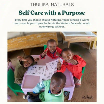 Green kids plastic chair with white cushion and grapefruit shower steamers gift set