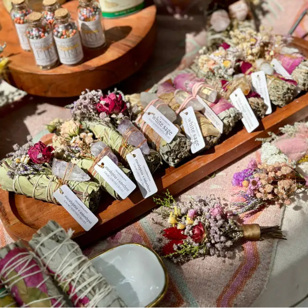 Handmade eucalyptus and amethyst wand on wooden tray