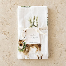 White cotton flour sack tea towel with watercolor deer and greenery tied with cream ribbon perfect as sack tea towel