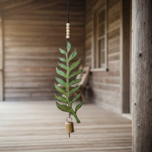 Handmade green leaf-shaped recycled metal wind chime with genuine brass bell