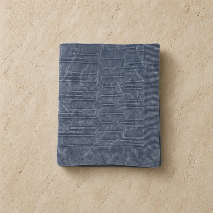 A soft slate-blue flintstone lines throw with ribbed edges in washed cotton perfect for cozying up