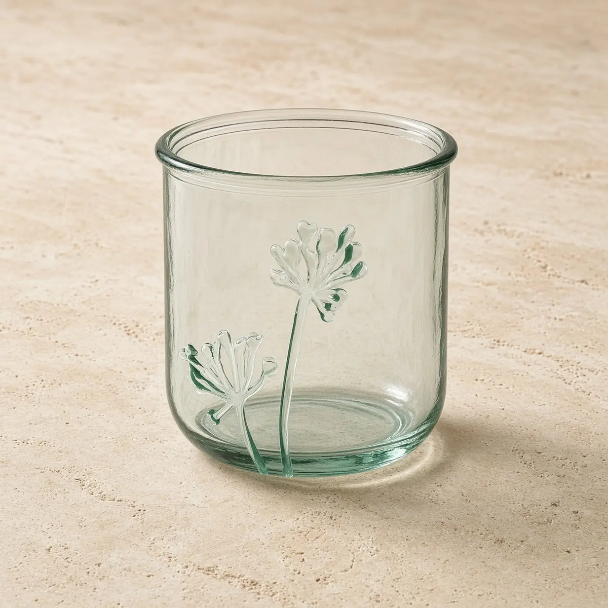 Clear glass classico flora tumbler with delicate raised dandelion designs made from recycled glass for nature-inspired elegance