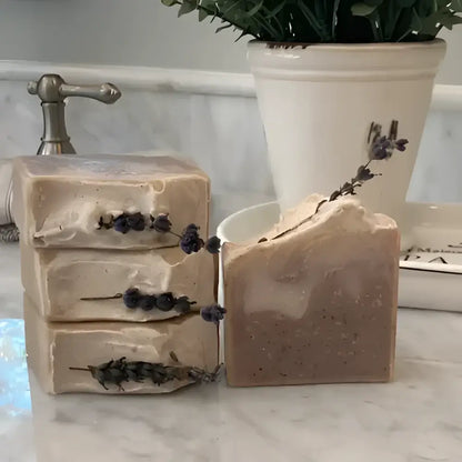  French Lavender shea butter bar soap, features a soothing lavender aroma complemented by bergamot, lemon, and eucalyptus top notes. The artisanal production process ensures each bar has distinctive color variations and unique swirl patterns.