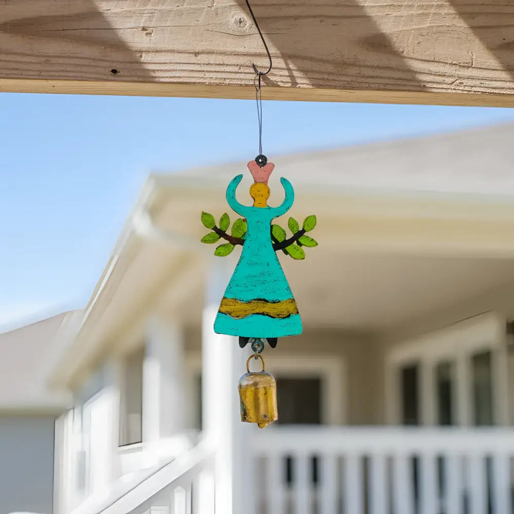 Turquoise wooden garden angel bell chime ornament with green leaf wings pink crown and yellow accents hanging