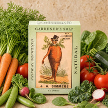 A vintage-style light green handmade soap box with a cartoon carrot man for eco-friendly gardener’s soap