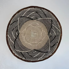Genuine Binga African wall basket with black, white, and tan circular woven pattern