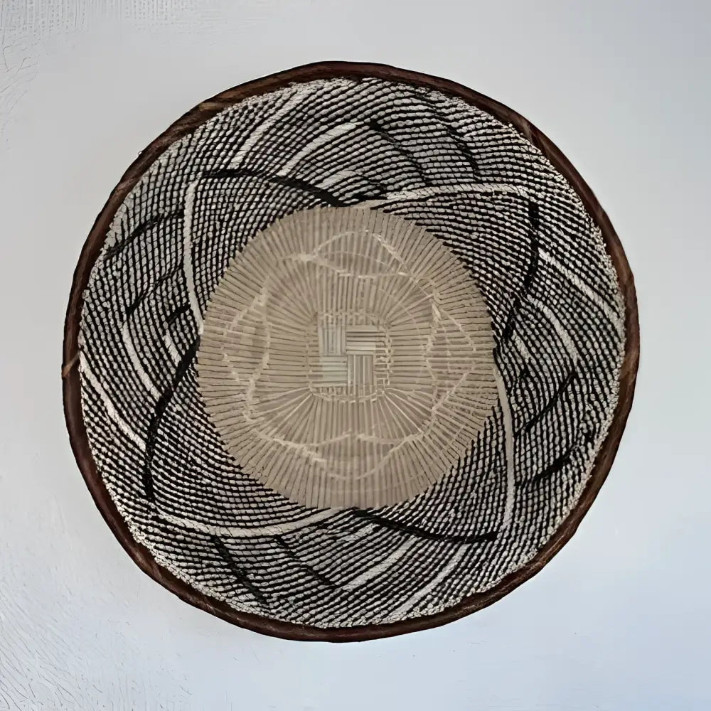 Round woven mat with concentric circle pattern on a plain background