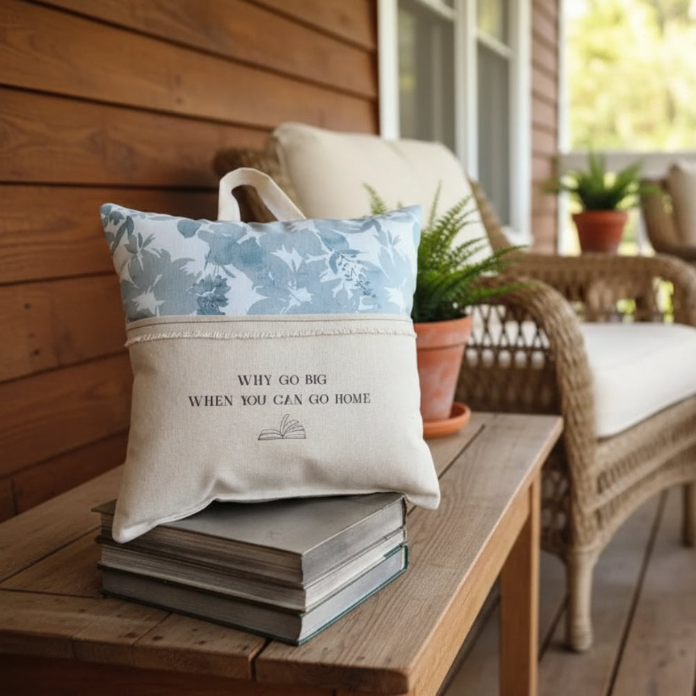 Handmade eco-friendly reading pillow with blue zinnia floral pattern and why go big when you can go home print