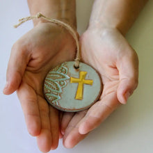 Gold leaf cross ornament back: matte blue glaze, yellow cross, lace details
