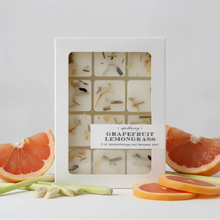 White rectangular box of translucent off-white soy-beeswax blend melts with phthalate-free uplifting citrus grapefruit lemongrass scent