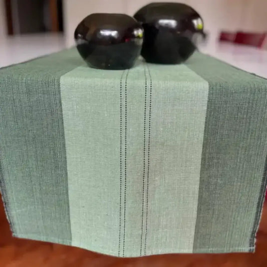 Green Ethiopian cotton table runner with central stripe and subtle dotted lines, handwoven style